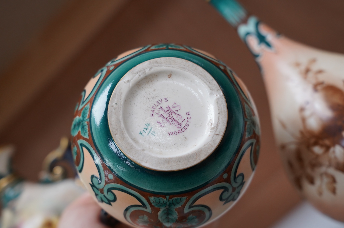 Hadley's Worcester: a pair of vases and two others, tallest 21.5cm. Condition - mostly good, largest vase has two chips to inner upper rim, areas of wear to gilding